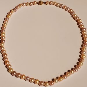 Strand of cultured pearls with multi colors of pink hues